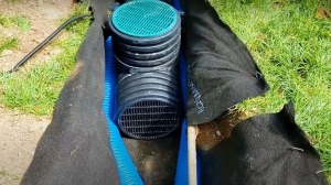 Outdoor sump pump installation with enough width for French drain pipes