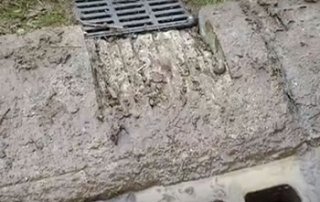 Cut Street Curb for French Drain in Michigan