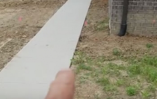 Burying / Running Downspouts New Construction in Michigan