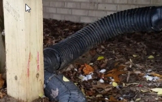 Downspouts under decks should be buried