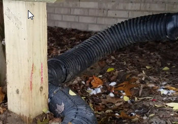 Downspouts under decks should be buried