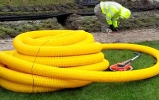 French Drain Install for yard drainage with a Sprinkler System