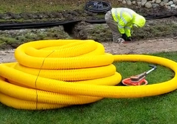 French Drain Install for yard drainage with a Sprinkler System