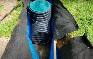 Outdoor sump pump installation with enough width for French drain pipes