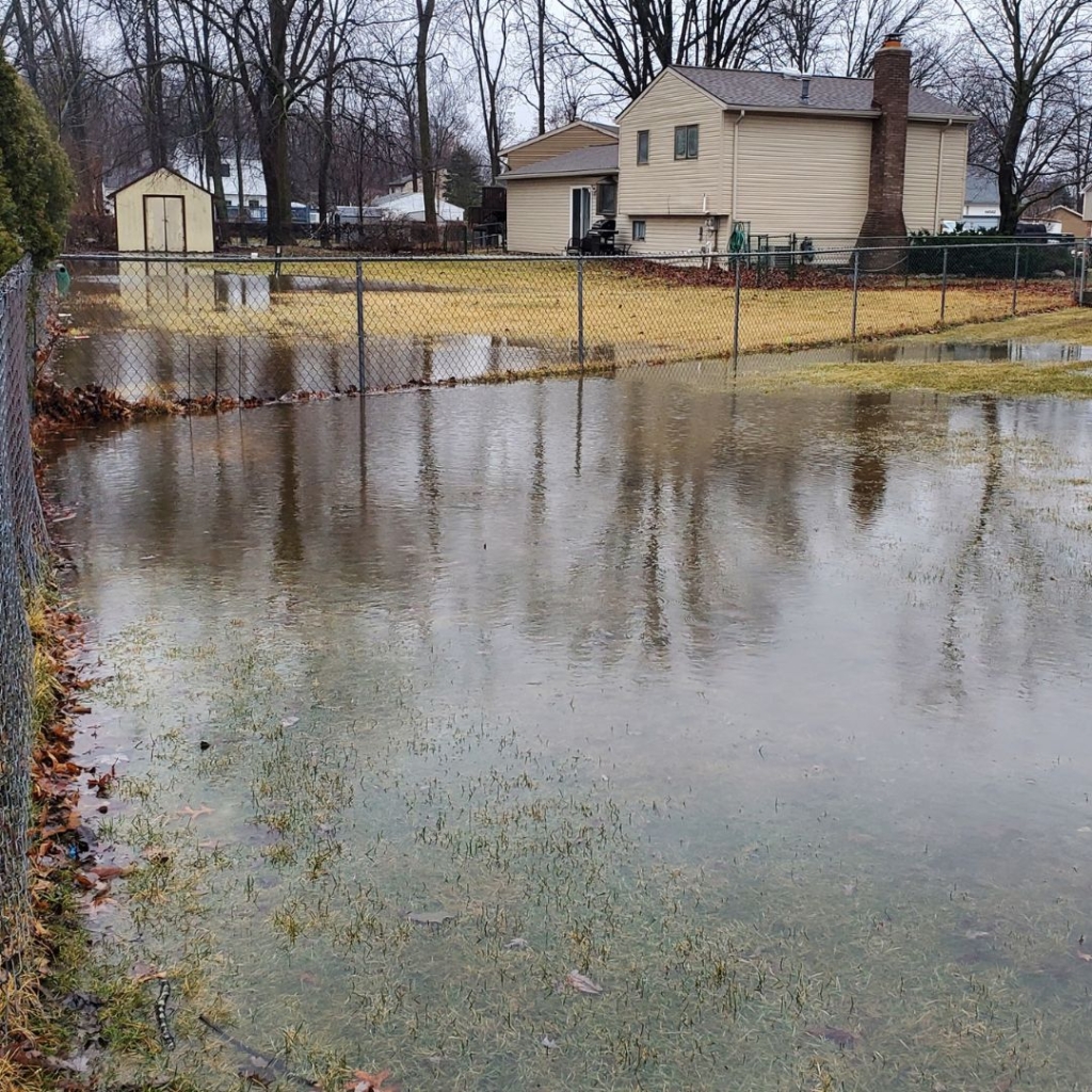 floodedyardfromdownspouts French Drain Systems Curtain Drains