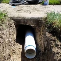 How to Bury Downspouts: Complete DIY Guide from the Pros